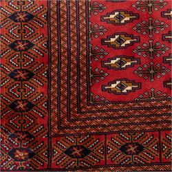 North East Persian Turkoman hand-knotted carpet, madder red field decorated with rows of repeating Tekke guls, in offset horizontal bands and interspersed cruciform subsidiary motifs, enclosed within narrow geometric borders featuring stylized tribal devices, with fringe ends   