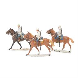 Three Holger Eriksson cast and hand-painted metal figures modelled as cavalry in winter un...