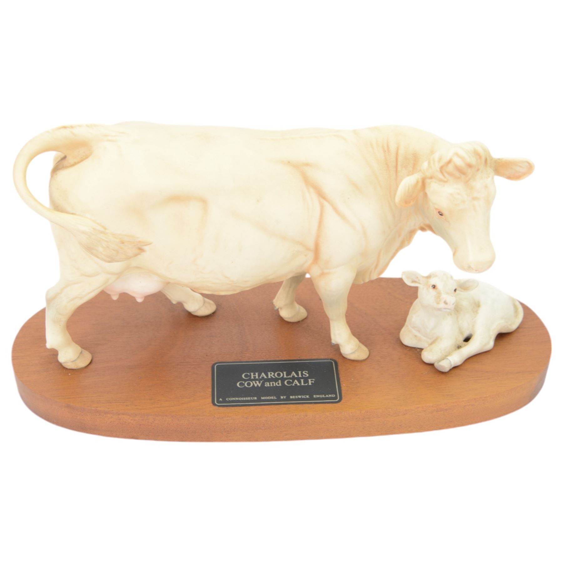 Three Beswick Connoisseur Cattle: Hereford Cow and Calf, Charolais Cow and Calf and Charolais Bull, all on wooden plinths, H20cm