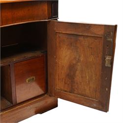 Victorian mahogany chiffonier, raised back with applied carvings, above a serpentine fronted base, a single frieze drawer, above a cupboard with shelf and drawer with campaign handle, raised on a plinth base