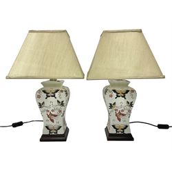 Pair of table lamps of square baluster form, decorated in a butterfly motif, upon a square...