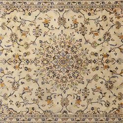 Central Persian Kashan hand-knotted carpet, ivory ground with central rosette medallion surrounded by scrolling floral vines and palmettes, field framed by a meander border flanked by multiple guard stripes, with cotton fringe end and a replaced fringe end
