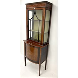 Edwardian inlaid mahogany display cabinet, single glazed door enclosing two lined shelves, above single cupboard, square tapering supports