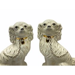 Beswick fireside Yorkshire terrier dog model no 2377 H25.5cm, together with a pair of staffordshire style white spaniels H30cm, two Mella ware terriers etc.  