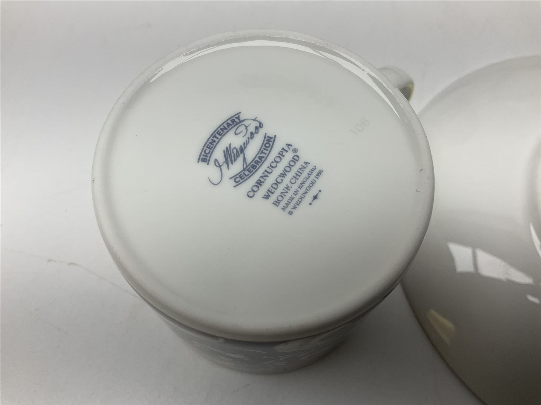 Wedgwood Cornucopia coffee service for six, comprising coffee pot, milk jug, twin handled covered sucrier, coffee cans and saucers