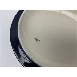 Moorcroft dish and cover, of circular form, decorated in Buttercup pattern, together with a Moorcroft vase, of baluster form, decorated in Magnolia pattern, both with printed marks beneath, tallest H9.5cm