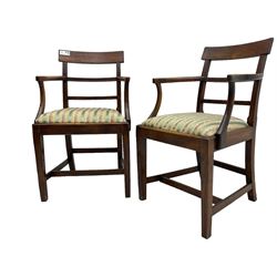 Pair of 19th century elm elbow chairs, bar back over horizontal rails, drop-in seats upholstered in striped fabric, on square tapering supports united by stretchers