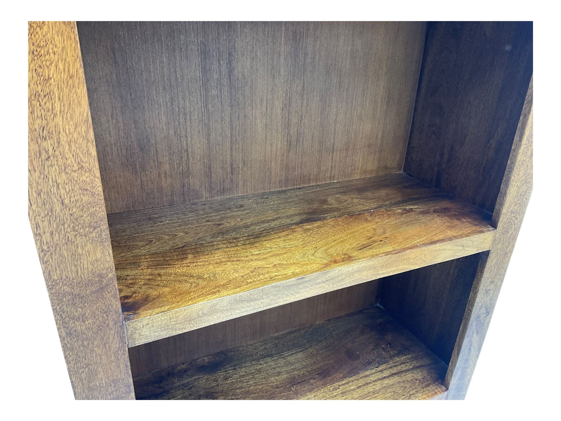 Contemporary Dakota mango wood open bookcase, rectangular form with four fixed open shelves, raised on stile supports