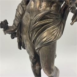 20th century silver plated figure, modelled as a classical male figure, possibly Prometheus, holding flames, one foot resting atop a small dragon, upon a circular spreading base, overall H37.5cm