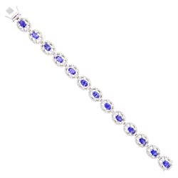 18ct white gold tanzanite and diamond bracelet, twelve oval link clusters set with oval cu...