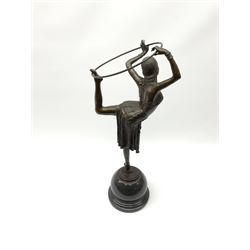 An Art Deco style bronze after J P Morante, modelled as a hoop dancer, signed and with foundry mark, upon black marble base, overall H51cm. 