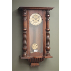 Late 19th century walnut cased Vienna style wall clock with compensating grid iron pendulum, with key, H69cm  