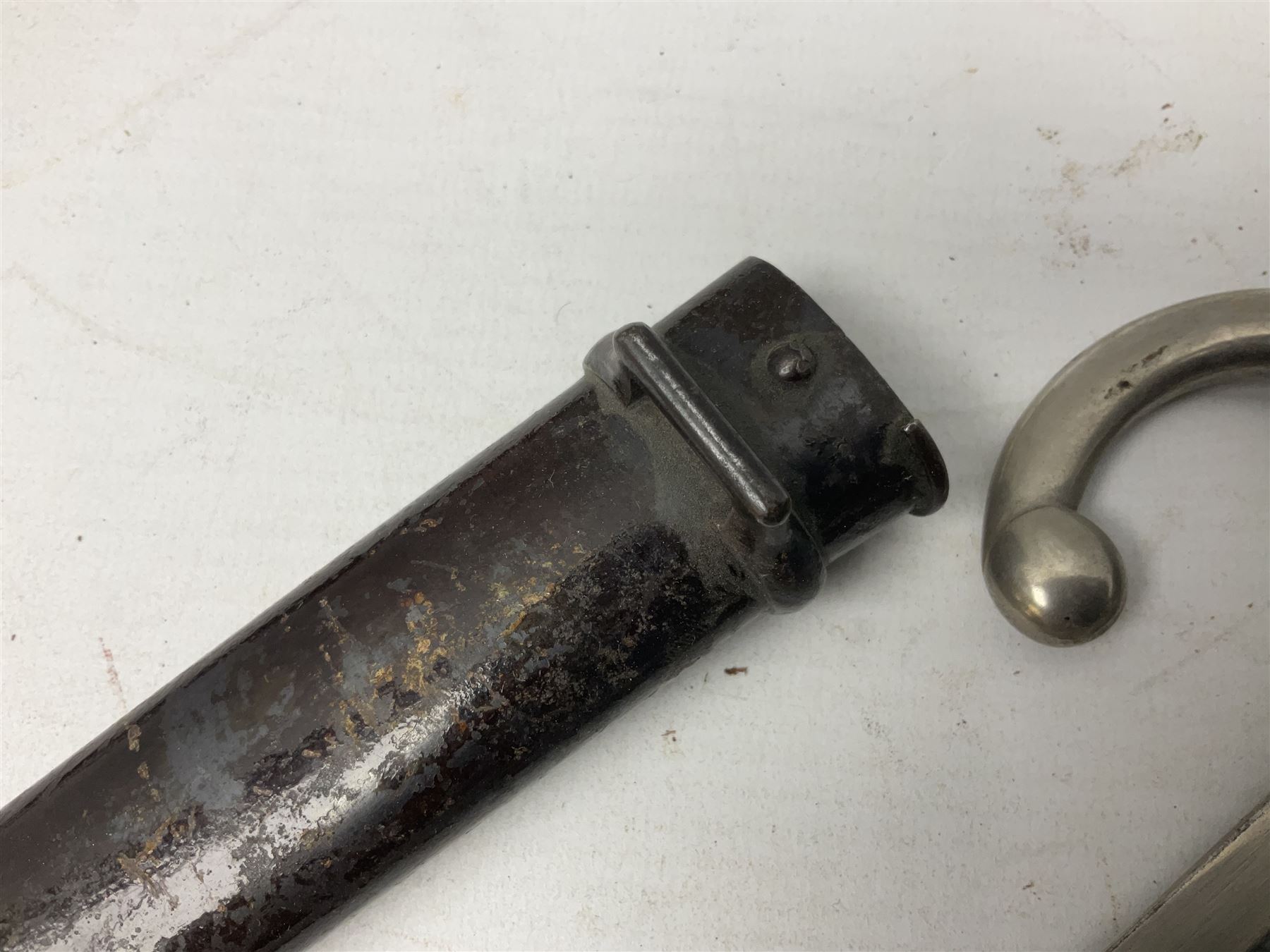 French Model 1866 Chassepot bayonet with 57cm curving fullered steel blade dated 1873 No.L63963; in steel scabbard with conforming number L71.5cm overall; and French St. Etienne Gras bayonet dated 1878 No.K10674 in steel scabbard numbered 79437 (2)