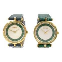 Two Gucci Shelly Line quartz wristwatches, white and green dial with gilt Roman numeral hour markers and GG logo back cases, both on green leather straps and both boxed