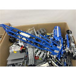 Very large collection of Lego, predominantly loose but some part constructed models, including Lego City, Lego Technic, Chima, Arctic 5, train set, mobile crane etc; together with numerous instruction booklets and some empty boxes; contained in two large cardboard boxes with gross weight of over 24kgs