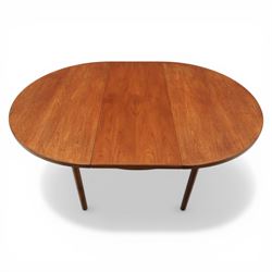 A H McIntosh & Co of Kirkcaldy - teak circular top with moulded edge enclosing butterfly leaf extension, raised on four tapering supports, extending action revealing central leaf, 167cm fully extended