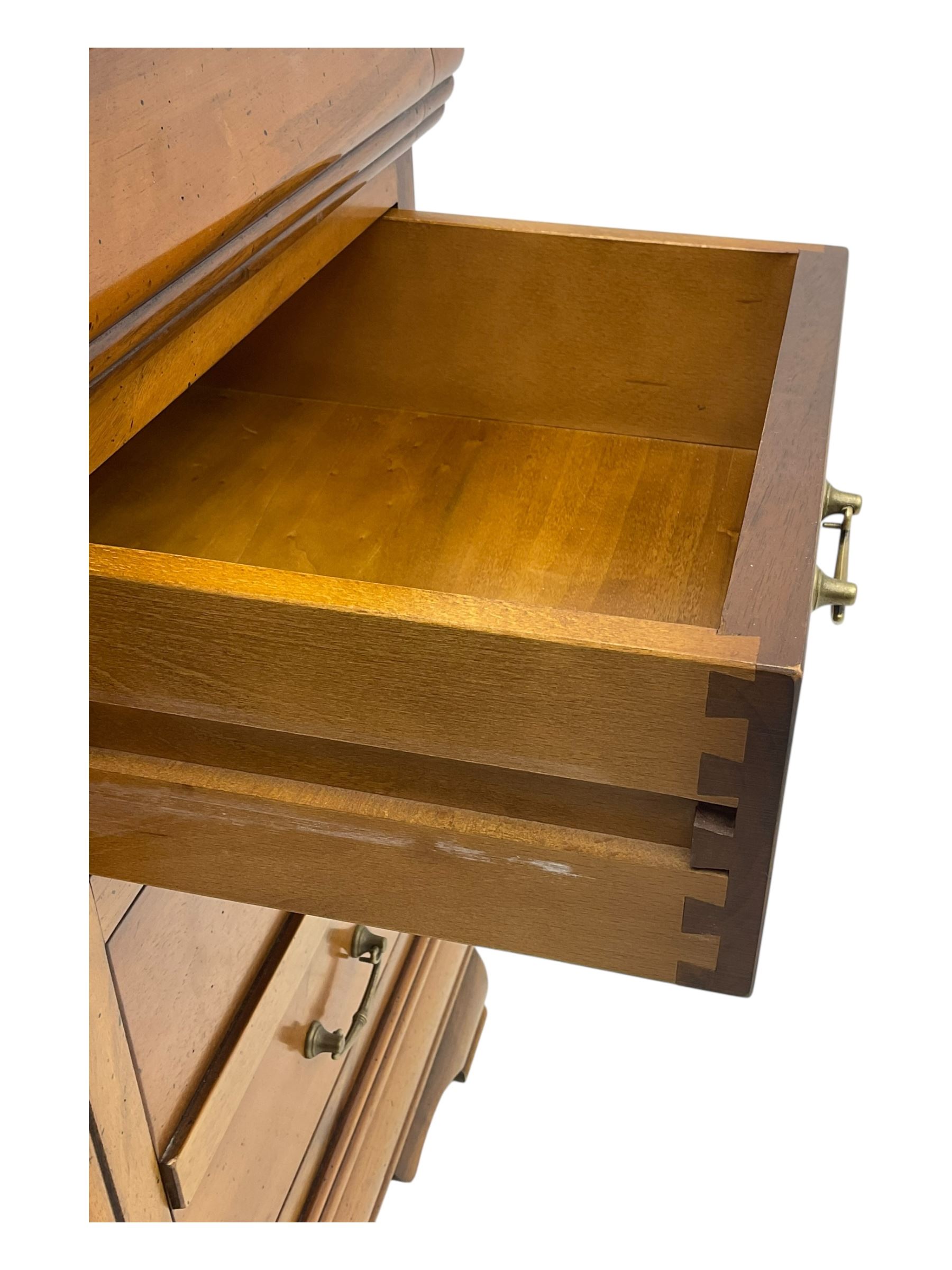 French cherry wood kneehole desk or dressing table, moulded rectangular top over twin pedestal bases each housing three drawers with brass-effect swing handles, resting on bracket feet