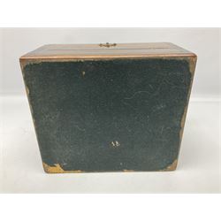 19th century walnut travelling toilet box, with shaped brass escutcheon and foliate engraved carry handle to the hinged cover, opening to reveal a blue silk and velvet lined interior with lift out tray, the fall front dropping to reveal three cut glass bottles with stoppers, H15cm W22.5cm D19.5cm
