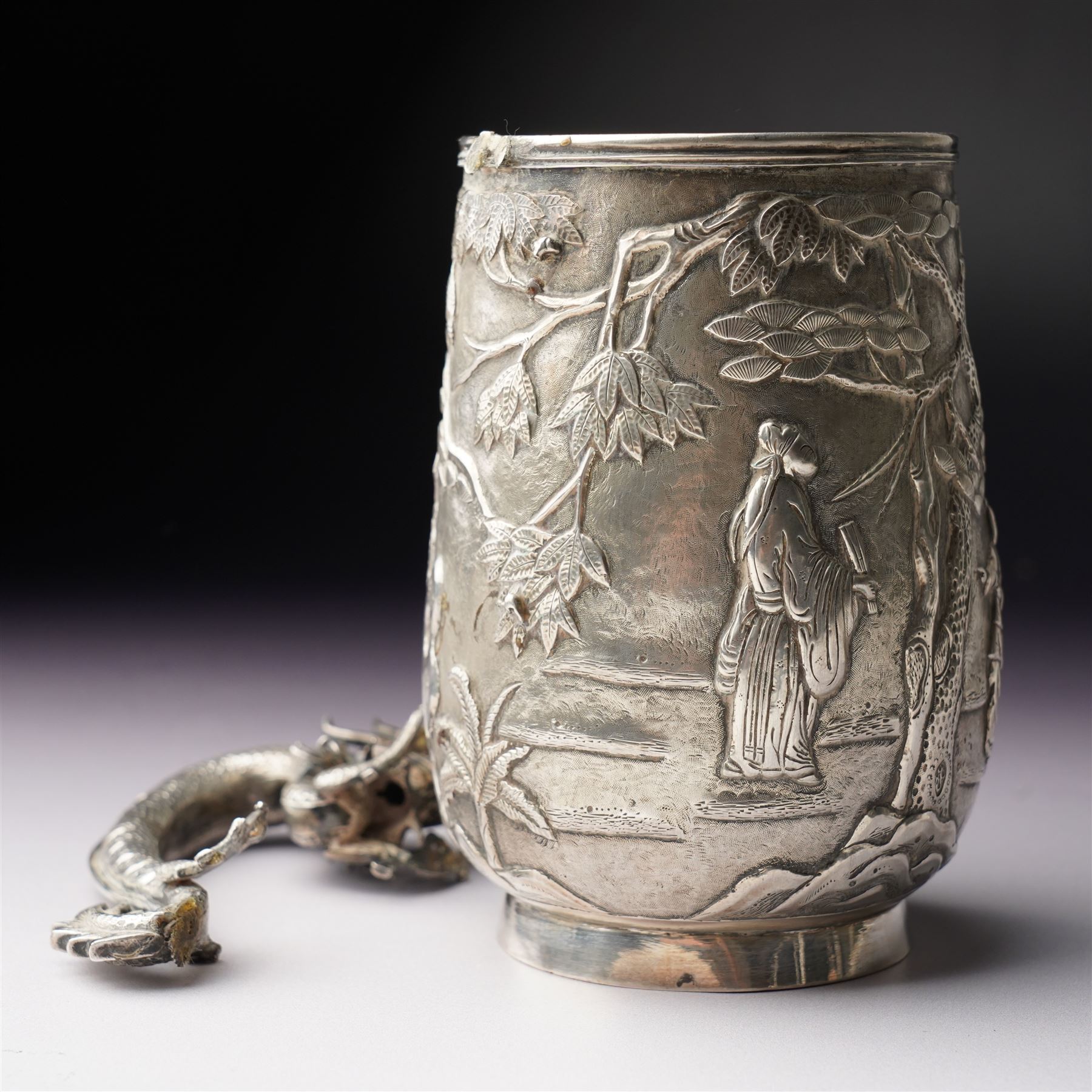 Chinese export silver mug embossed with figures and landscape with