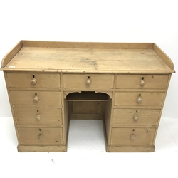 Victorian pine desk raised shaped back, nine drawers, platform base, W118cm, H83cm, D49cm