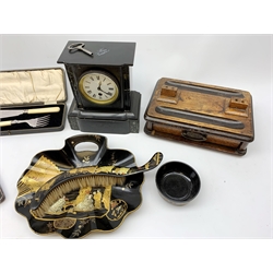 A black slate mantle clock, the white enamel dial with black Roman numerals, H23.5cm, a Victorian papier mache crumb tray and brush with gild chinoiserie decoration, cased set of fish servers with silver ferrules, hallmarked Sheffield 1934, and cased set of six pickle forks with silver ferrules, hallmarked Sheffield 1930, etc. 