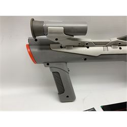 Two Super Nintendo Entertainment System (PAL) controllers, accessories and games. Super NES Game Commander with original box and instruction booklet, Super NES Nintendo Scope (1992) transmitter gun, receiver, Super NES Nintendo Scope 6 game with original instruction booklets. Further games to include ‘The Legend of Zelda a Link to the Past’, ‘Super Mario World’, ‘Super Mario Kart’, ‘The Lawnmower Man’, and ‘Exhaust Heat’, all with original instruction booklets. ‘PowerMonger’ and Disney’s ‘Aladdin’ game cartridges only 