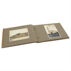 Early 20th century photograph album, documenting the travels of RMS Alcantara, with painting to front cover and containing black and white photographs