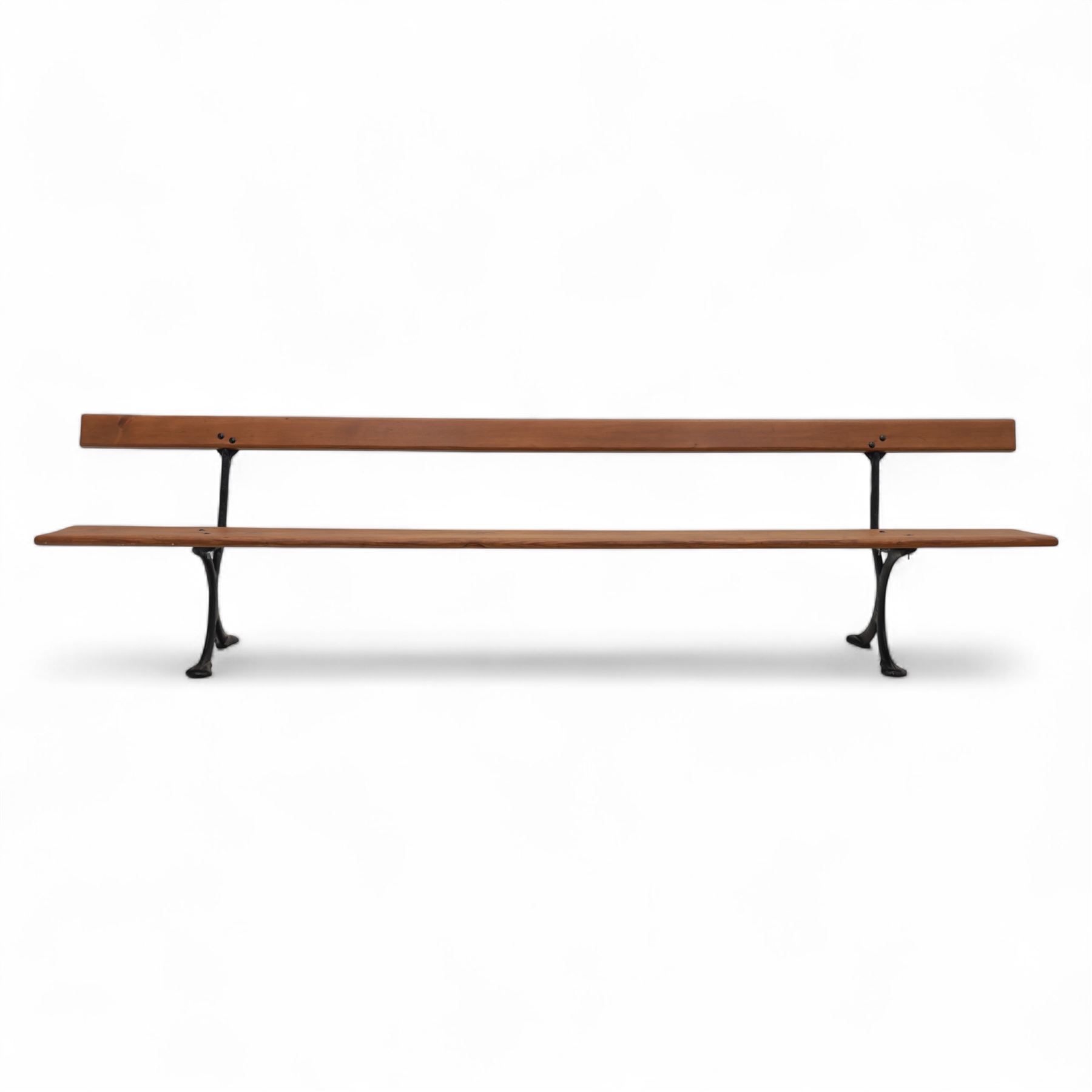 Pine garden bench, with stained and weatherproof varnish, single slat pine seat and back, raised on curved black cast iron supports