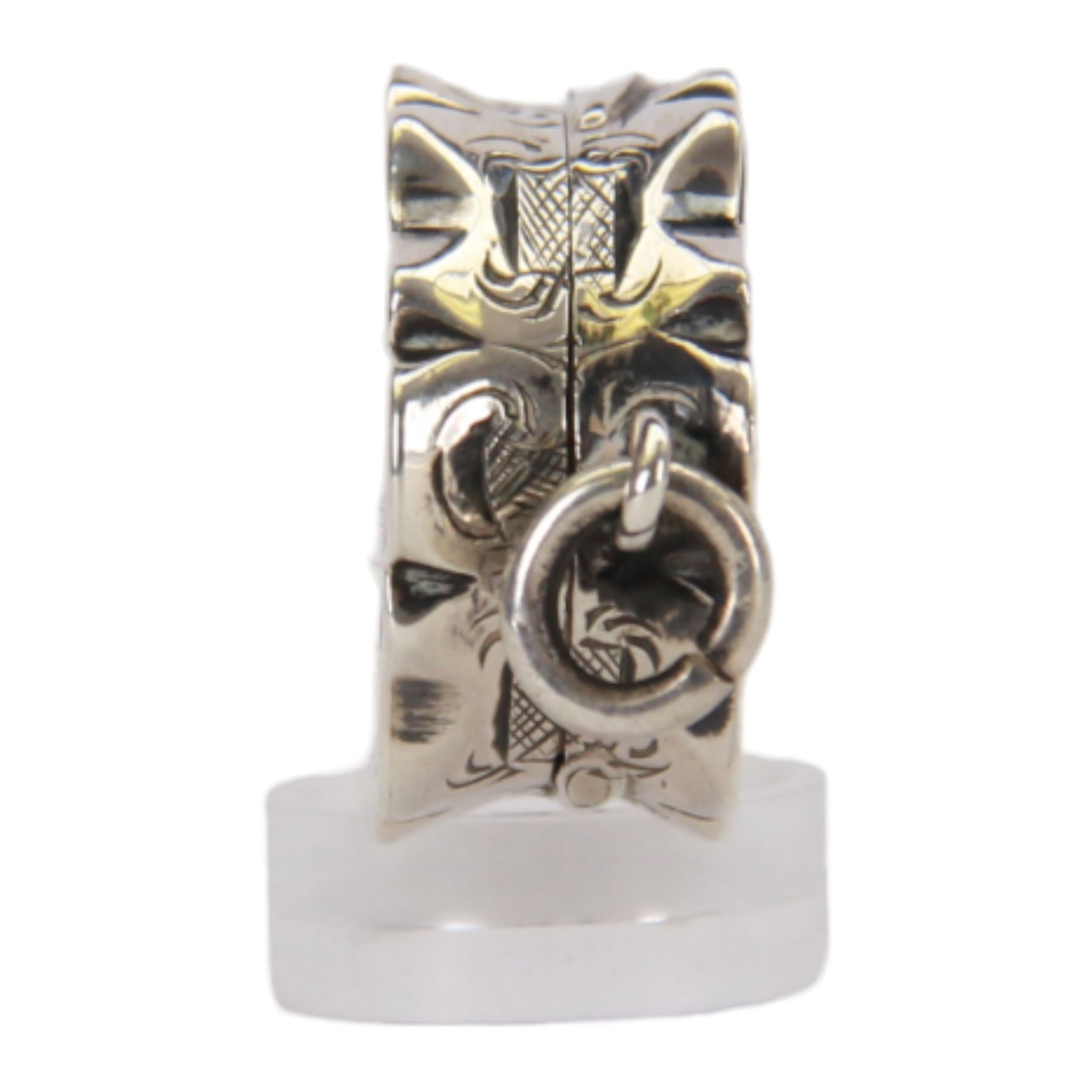 Victorian silver vinaigrette, of oval form with shaped edge, decorated throughout with engine turned bands, the hinged cover with vacant C scroll panel opening to reveal a foliate pierced grille and gilt interior, hallmarked George Unite, Birmingham 1857, L3.5cm