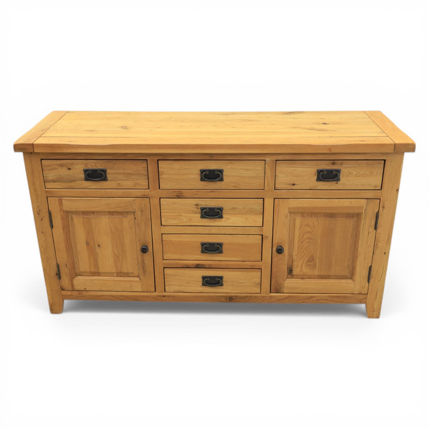 Modern light oak sideboard, fitted with six drawers and two cupboards