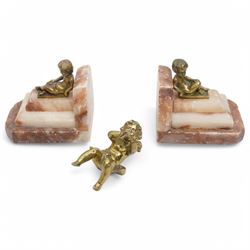 Brass and marble bookends with reclining putti figures, together with a brass figure of a ...