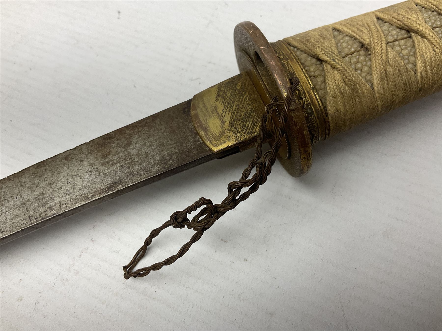Japanese tanto dagger with 25cm single edged blade, gilded plain punched tsuba, cord bound ray skin grip incorporating menuki and ornate gilded metal mounts L39cm overall