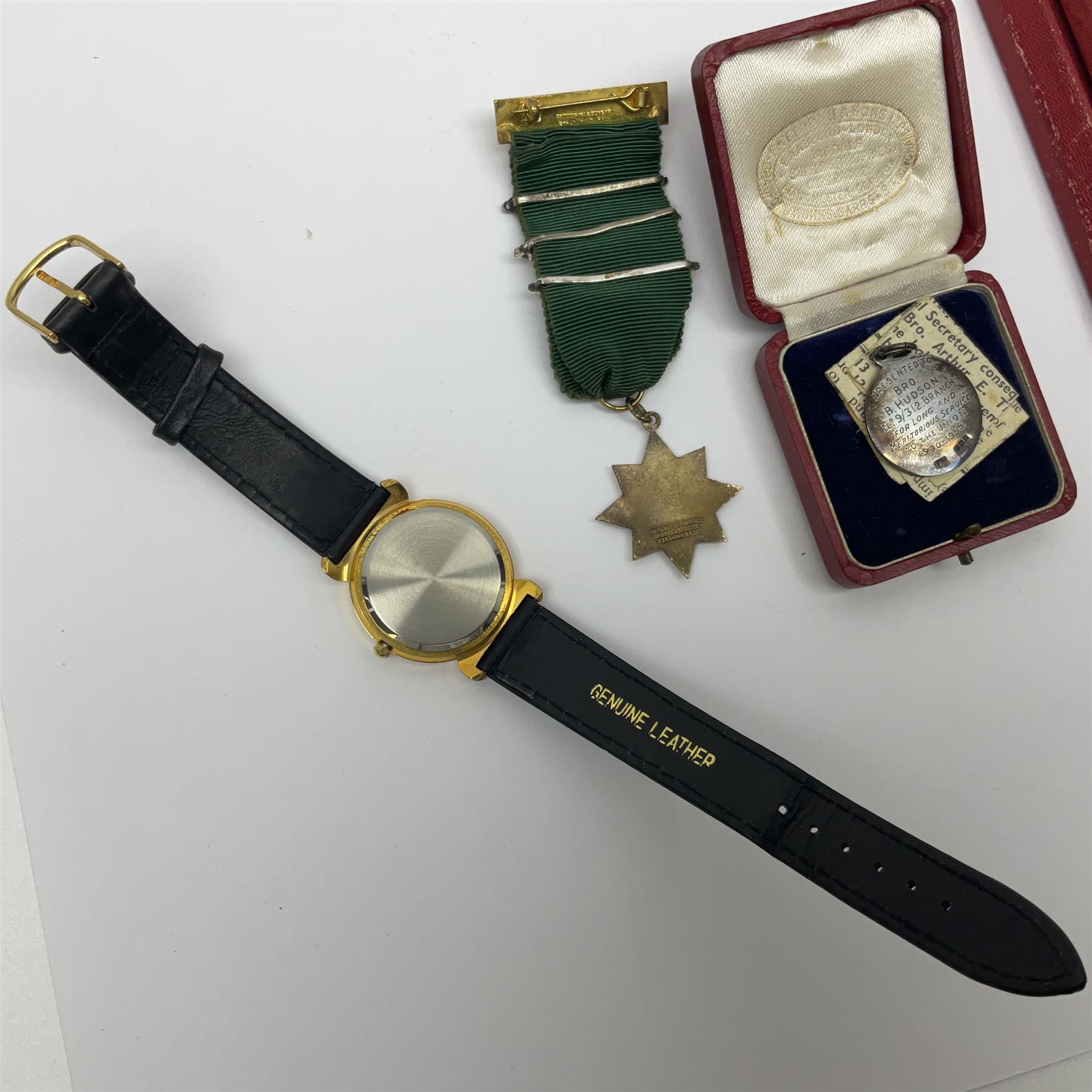 Ladies Accurist 9ct gold manual wind wristwatch, on gilt metal bracelet, together with a silver and enamel fob, for the Transport and General Workers Union, with personal engraving to reverse, hallmarked, a safe driving medal and a Quartz wristwatch
