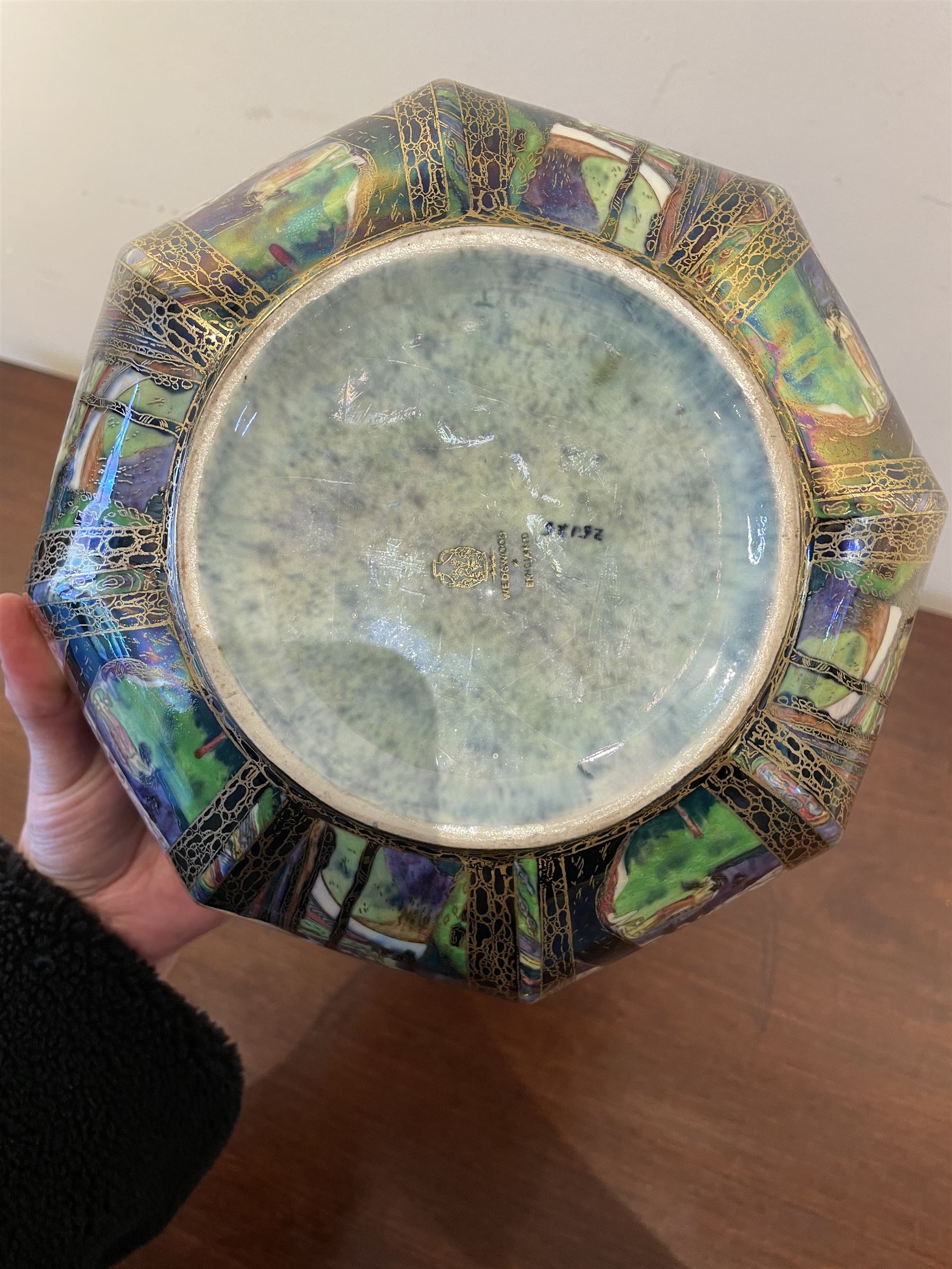 Early 20th century Wedgwood Fairland lustre bowl, circa 1920, of octagonal form, designed by Daisy Makeig-Jones, the exterior decorated in the Castle on the Road pattern, the interior decorated in the Fairy in a Cage pattern, pattern no Z5125, with printed marks beneath, H11cm D22.5cm
