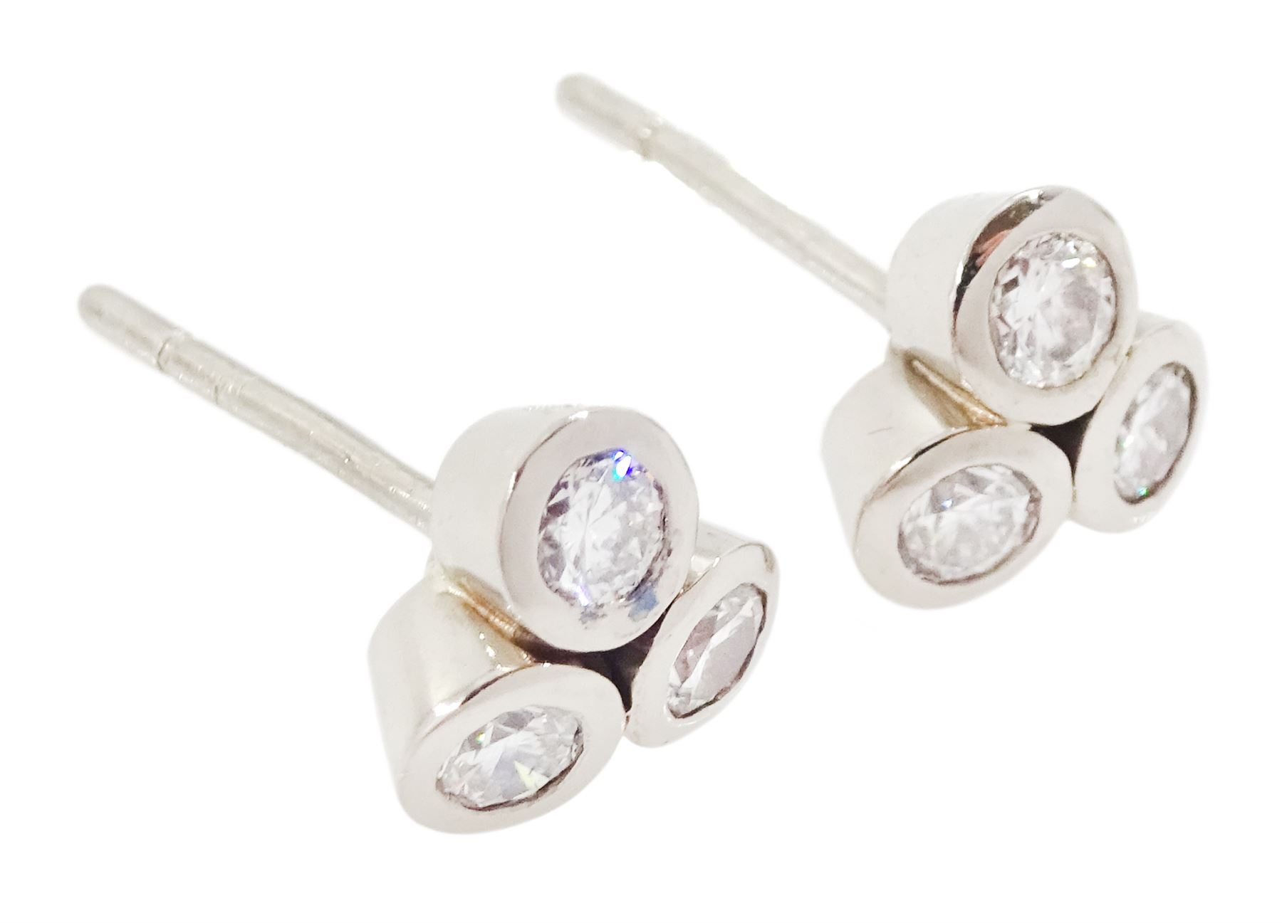 Pair of white gold bezel set, round brilliant cut diamond cluster stud earrings, total diamond weight approx 0.65 carat
