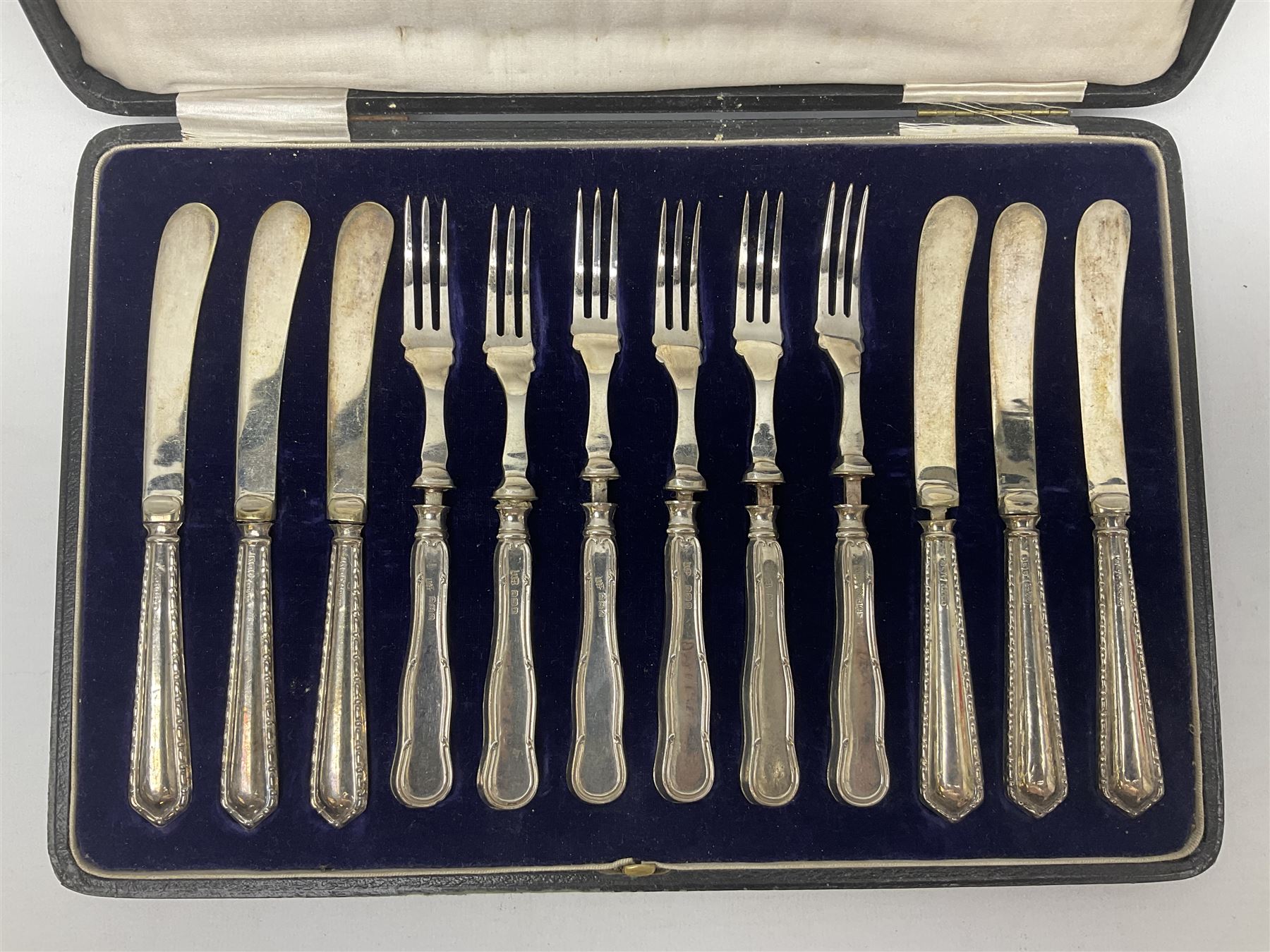 Cased set of six silver handled dessert knives and forks, hallmarked 