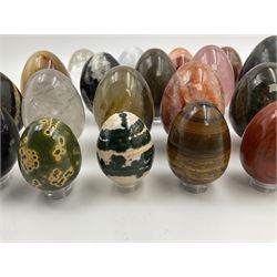 Collection of twenty-one hardstone specimen eggs, including labradorite, calcite, orbicular jasper, tiger's eye, smokey quartz, fossilised wood etc, originally part of the collection of the late Stanley J Seeger