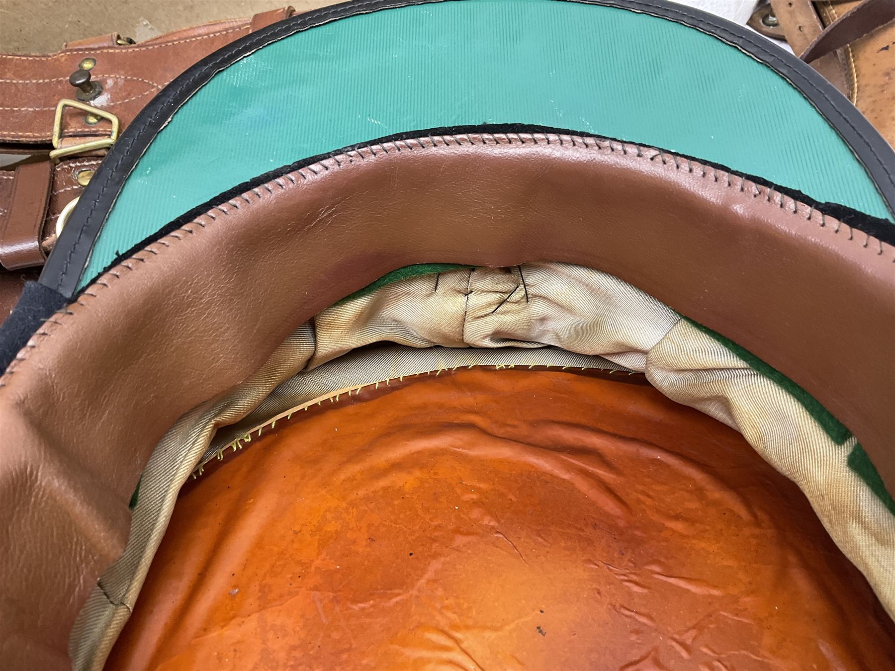 British Army General Staff officer's peaked cap by Herbert Johnson London in Moss Bros. delivery box; two officer's Sam Browne leather belts; leather pistol holster and sword hanger; pair of leather gloves and pair of spurs