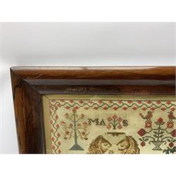 Victorian Berlin Woolwork picture, depicting a recumbent Spaniel and three puppies, along with motifs of stylised flowers and urn of flowers surmounted by two birds, indistinctly initialled MAS[?], within a strawberry vine border, in rosewood frame, overall H59cm L69cm