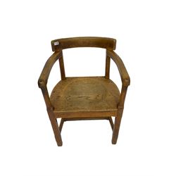 Arts and Crafts oak armchair, curved cresting rail with chamfered arm supports over panelled seat, raised on chamfered supports united by H-stretcher