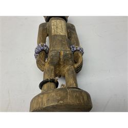 Early 20th century West African Yoruba family wooden figure of Orisha Oko, the god of farming/agriculture, carved from the solid, bears manuscript label of provenance verso H26.5cm