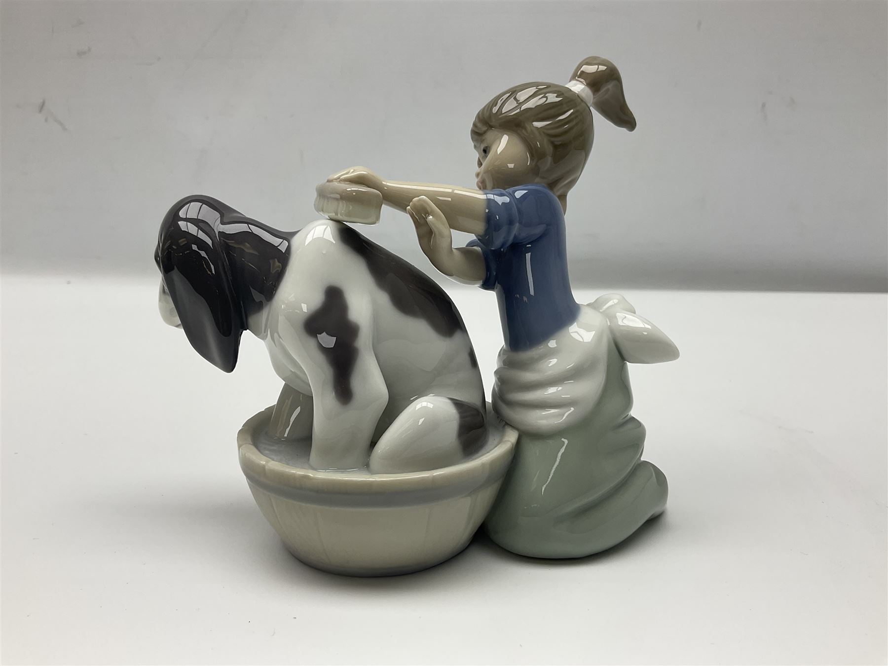 Pair of Lladro figures comprising 'Mis Amigos' model no 5456, and 'Bashful Bather' model no 5455, both with boxes