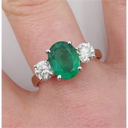 18ct gold three stone oval emerald and round brilliant cut diamond ring, hallmarked, emerald approx 1.70 carat, total diamond weight approx 0.80 carat