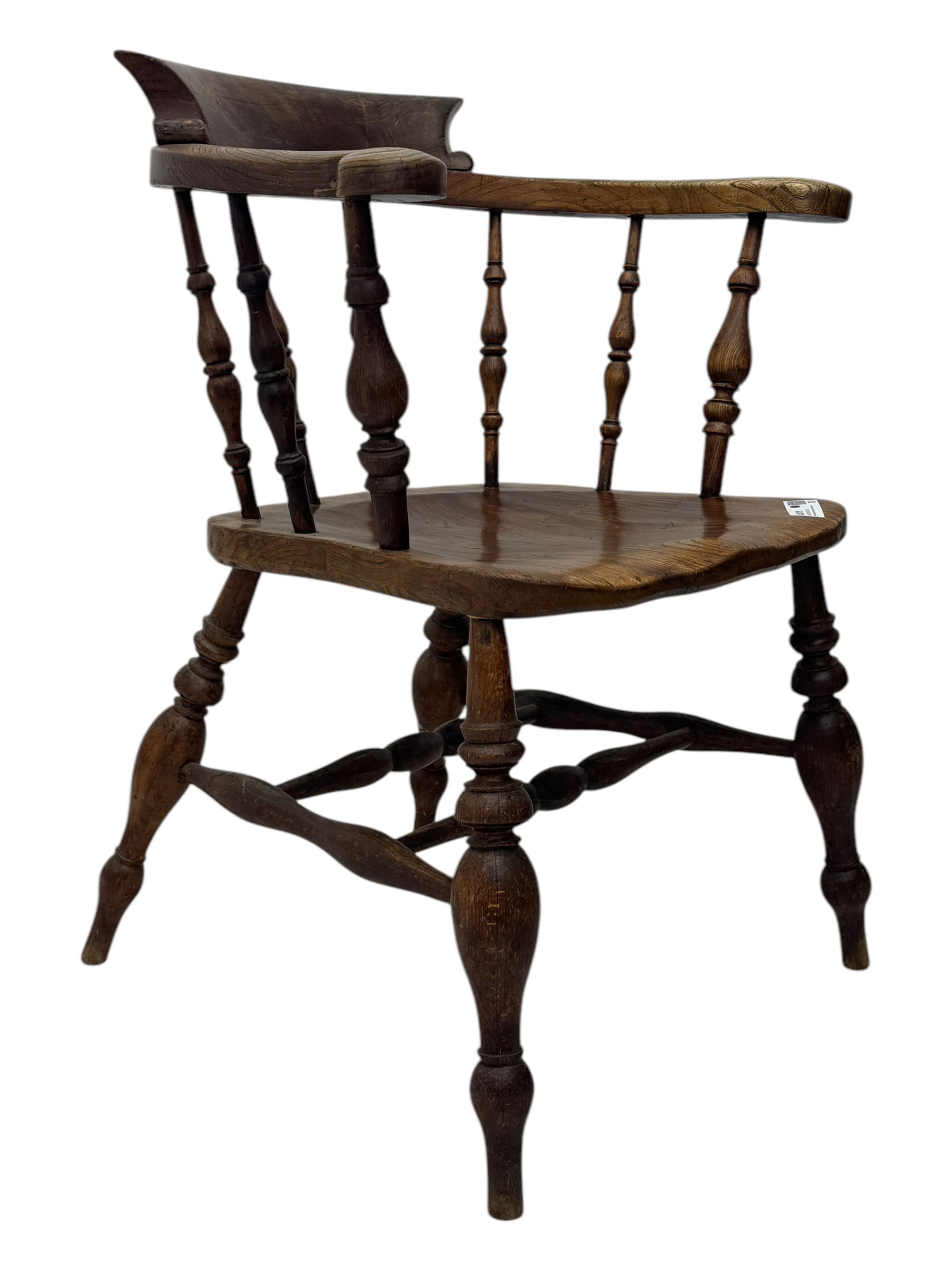 19th century elm and beech smoker's bow armchair, shaped arms over turned spindle gallery and dished seat, on turned supports united by double H-shaped swell turned stretchers 