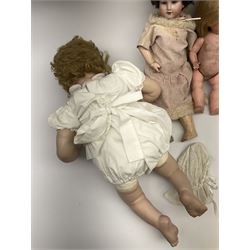 A modern ceramic head doll, with 'TA7703' and impressed signature to back of head, together with two other dolls. 