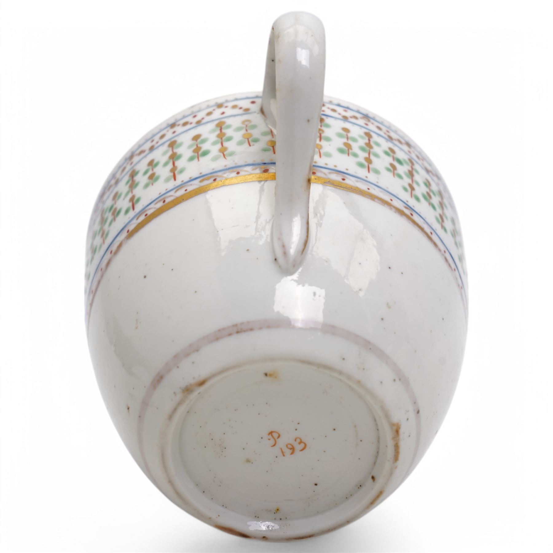 Pinxton porcelain trio, pattern no.193, comprising coffee can, teacup and saucer, decorated with green and gilt stylised sprigs and red and gilt dot borders, teacup with painted marks to base (3)