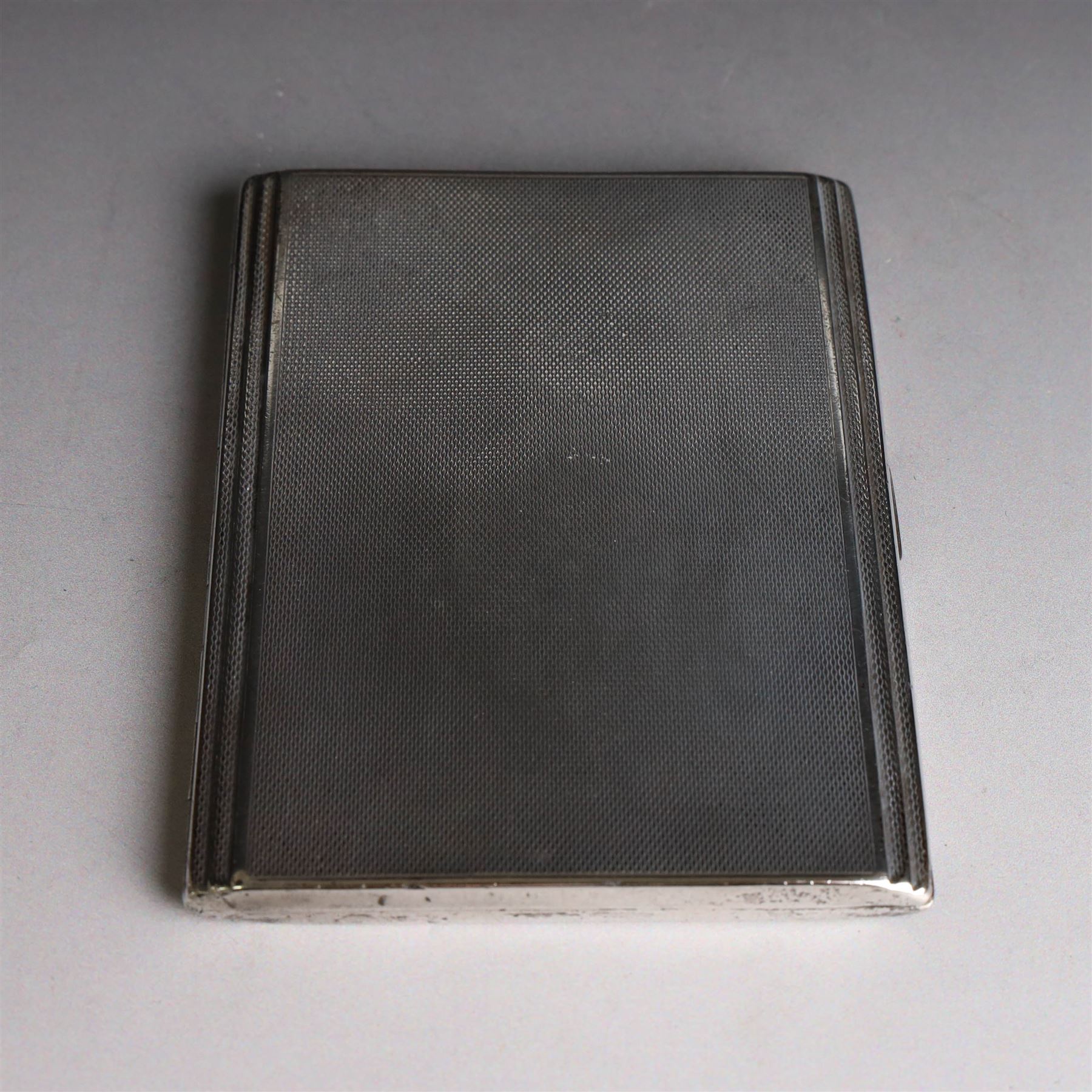 1930s silver cigarette case, with stepped design and engine turned decoration, hallmarked Clark & Sewell, Chester 1938, H11cm