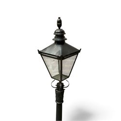Victorian-style cast iron lamp post in a black finish,
