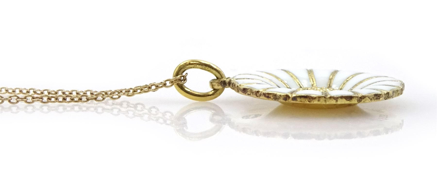 Silver-gilt white enamel daisy pendant necklace and matching pair of pendant earrings by Georg Jensen