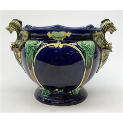 A 19th Century majolica blue ground jardinière, with twin dragon handles, H26cm. 